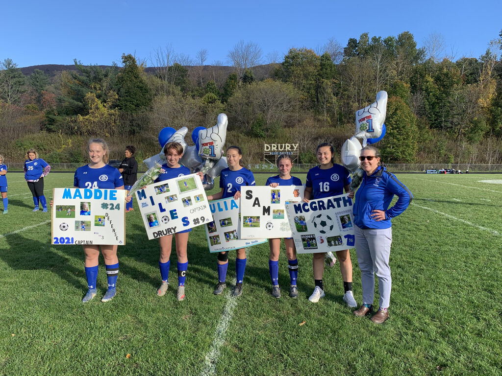 Drury girls and coach Maria Bartini on senior day